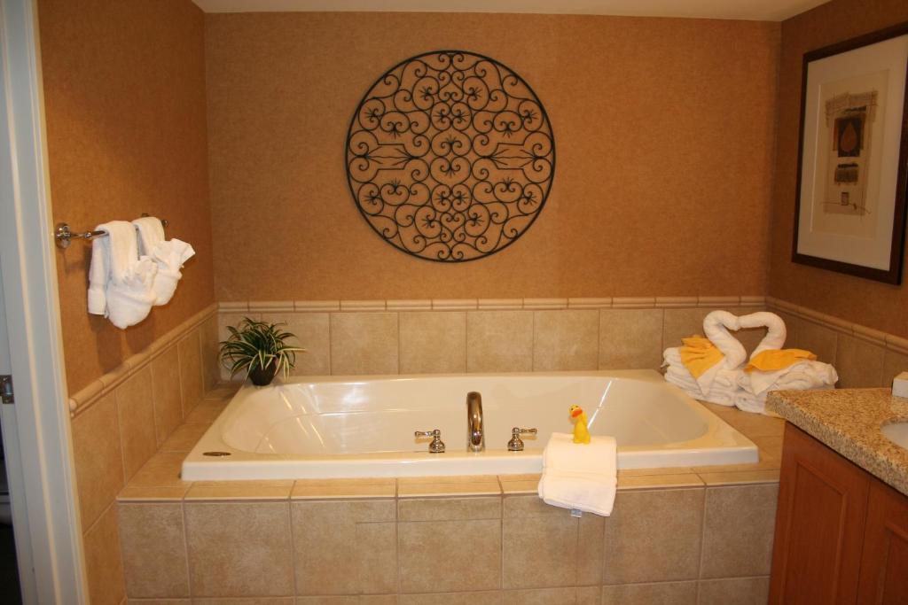 a bathroom with a bath tub with a towel at Gold Country Casino Resort in Oroville