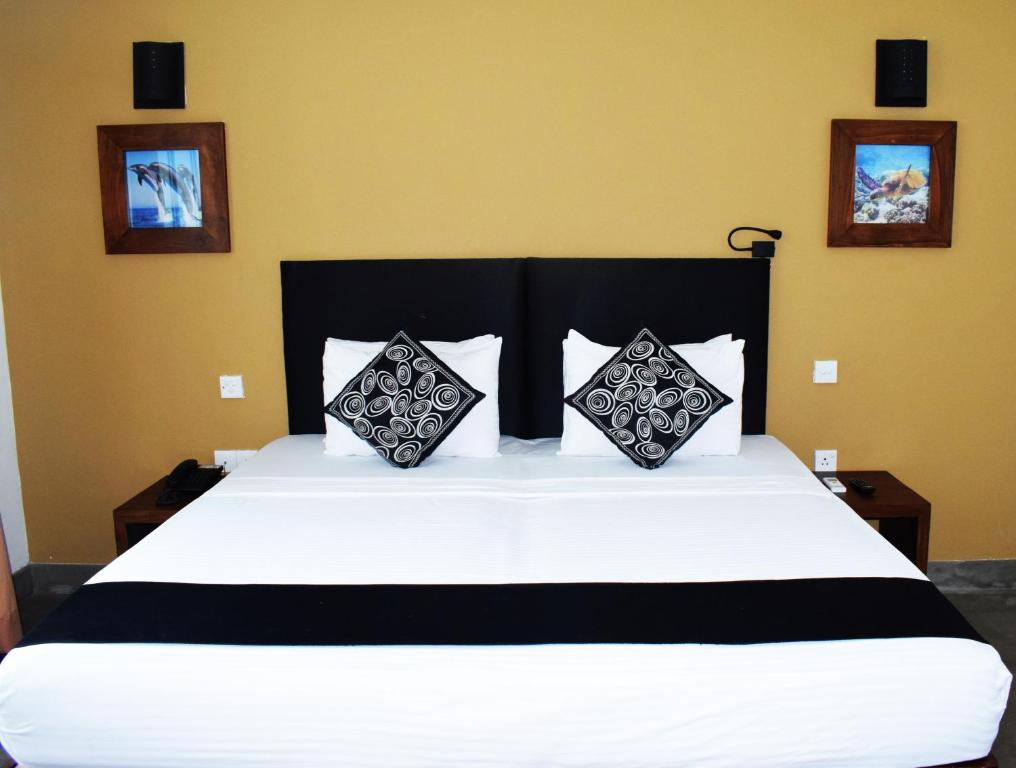 Voodi või voodid majutusasutuse Nildiya Riverside Safari Hotel toas