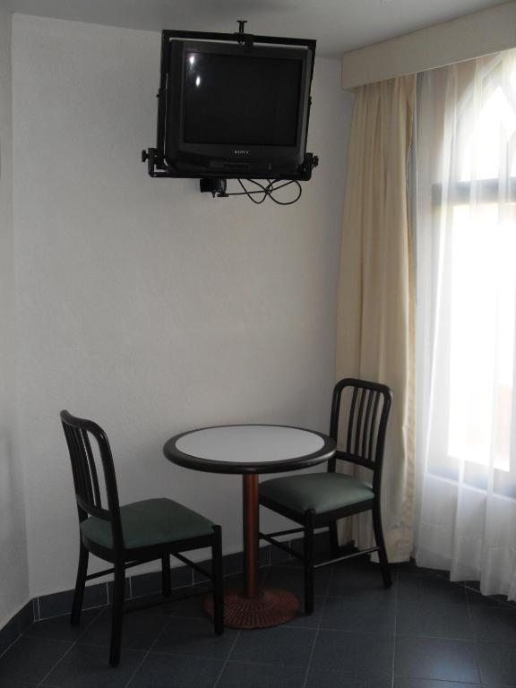 TV a/nebo společenská místnost v ubytování Hotel Playa Cristal