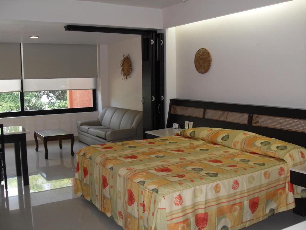 Postel nebo postele na pokoji v ubytování Hotel Playa Cristal