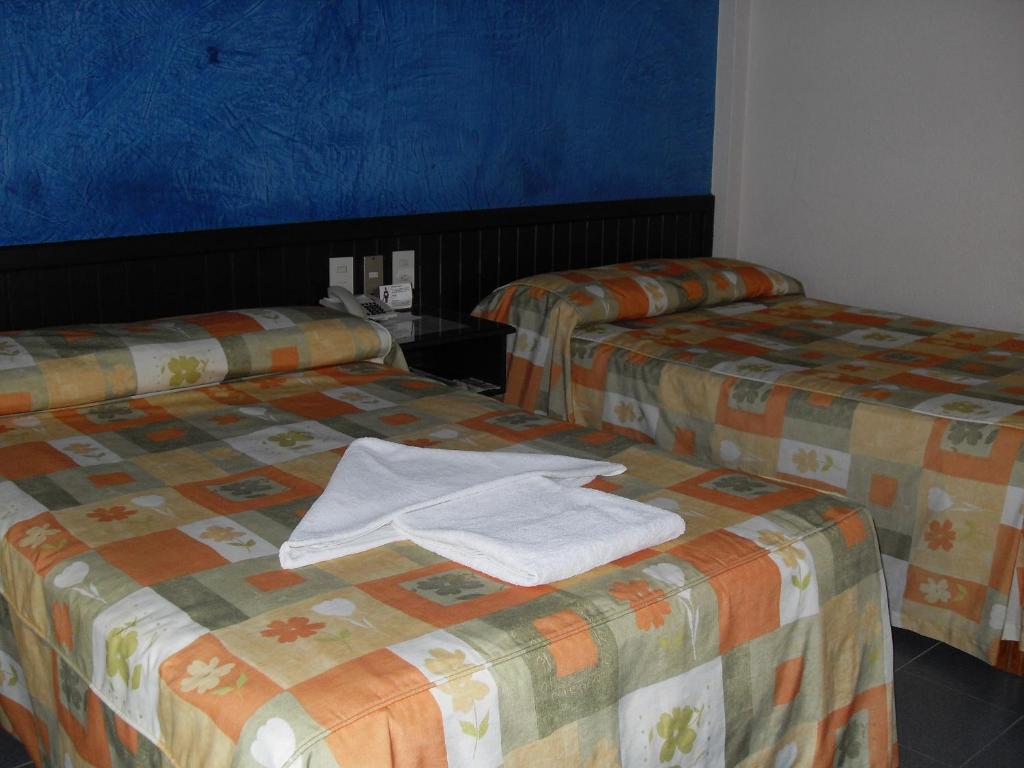 Postel nebo postele na pokoji v ubytování Hotel Playa Cristal