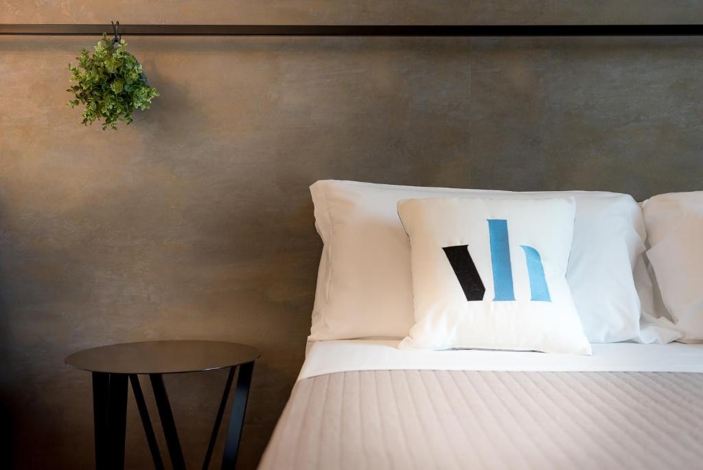 Postel nebo postele na pokoji v ubytování Hotel Vagabond