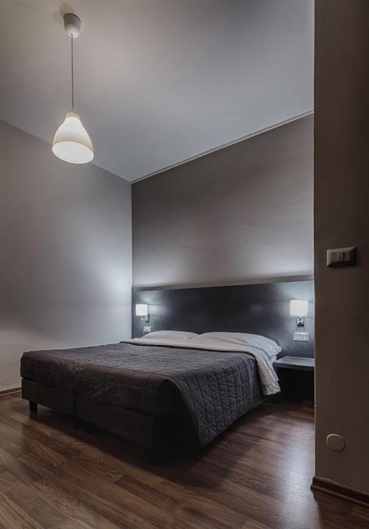 Postel nebo postele na pokoji v ubytování Twelve Hotel