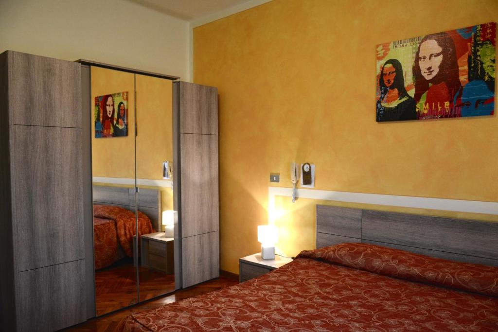 Postel nebo postele na pokoji v ubytování Hotel Pinamonte
