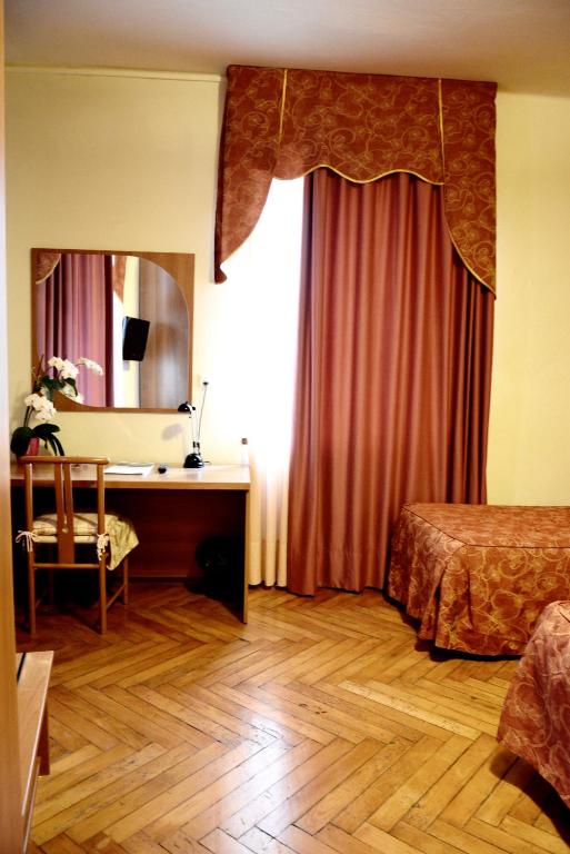 Postel nebo postele na pokoji v ubytování Hotel Pinamonte