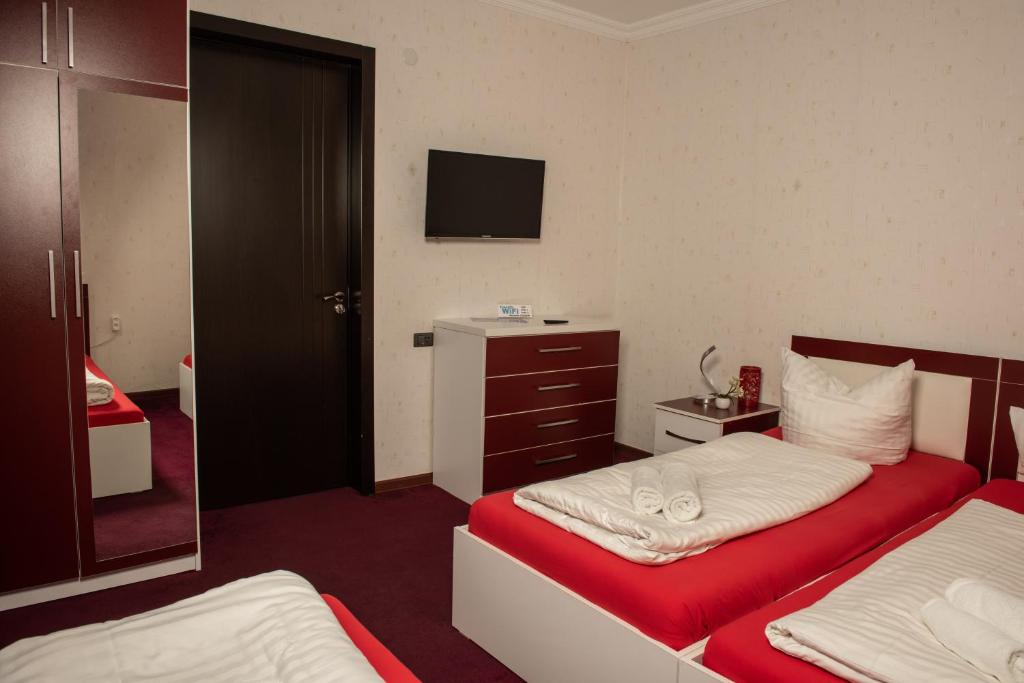 Llit o llits en una habitació de Guest House VIP