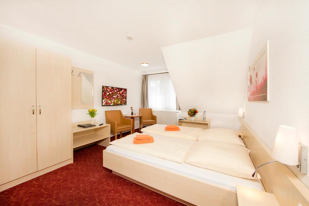 Postel nebo postele na pokoji v ubytování Ferienhotel Bernstein