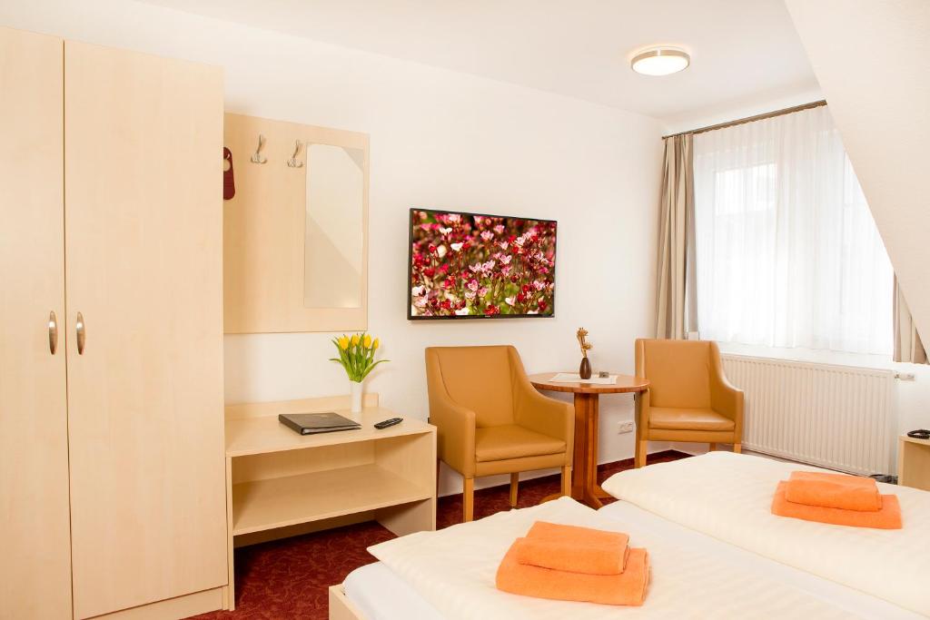 Postel nebo postele na pokoji v ubytování Ferienhotel Bernstein