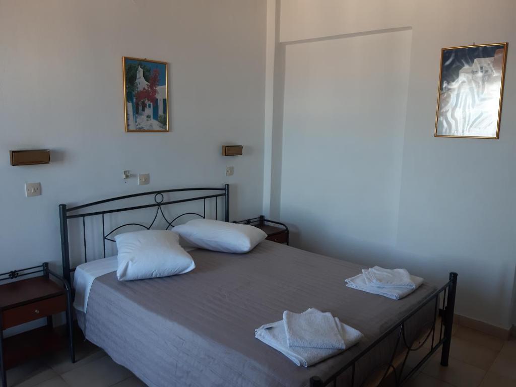 Postel nebo postele na pokoji v ubytování Villa Firostefani