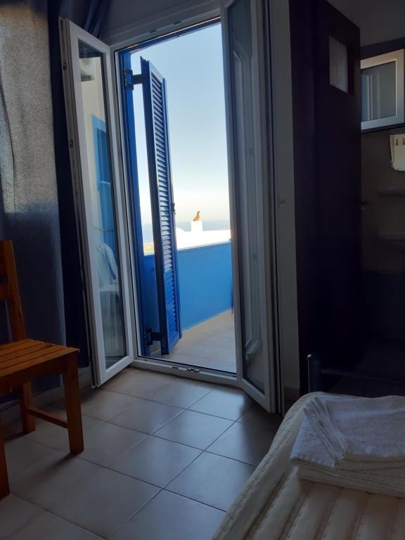 Postel nebo postele na pokoji v ubytování Villa Firostefani