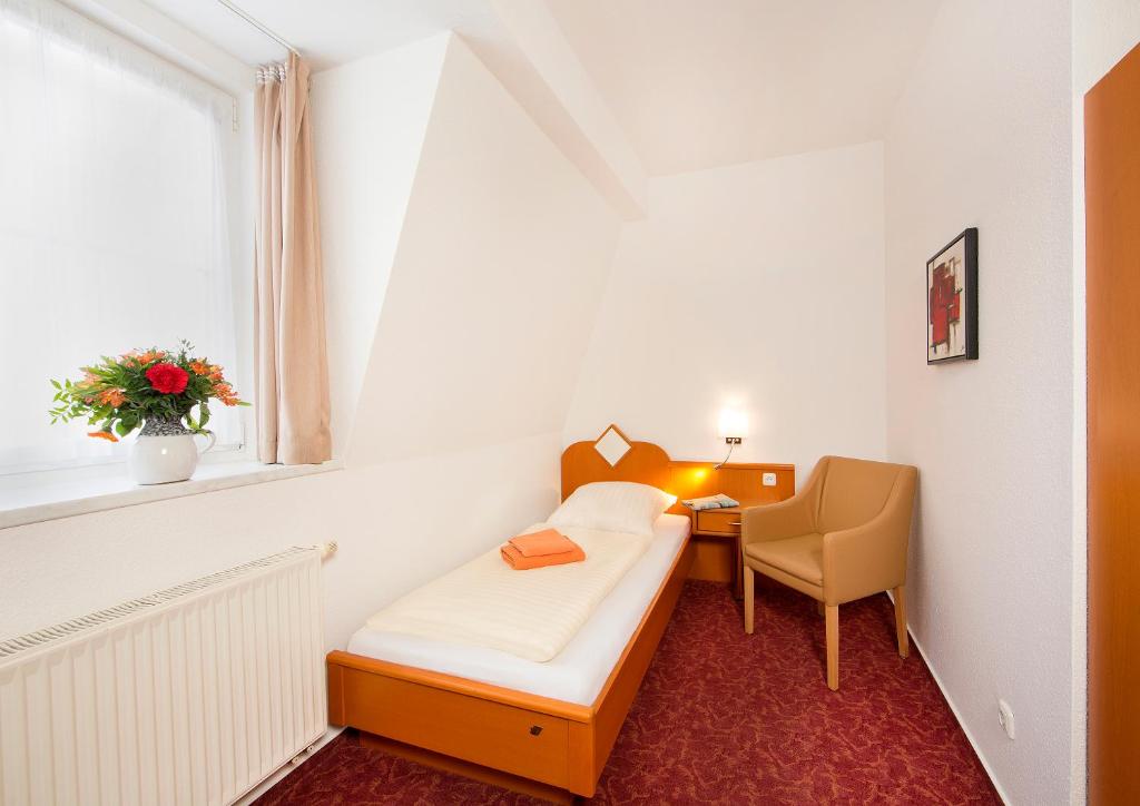 Postel nebo postele na pokoji v ubytování Ferienhotel Bernstein