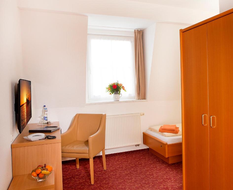 TV a/nebo společenská místnost v ubytování Ferienhotel Bernstein