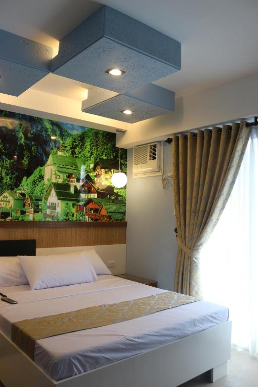 Postel nebo postele na pokoji v ubytování Eurotel Boracay