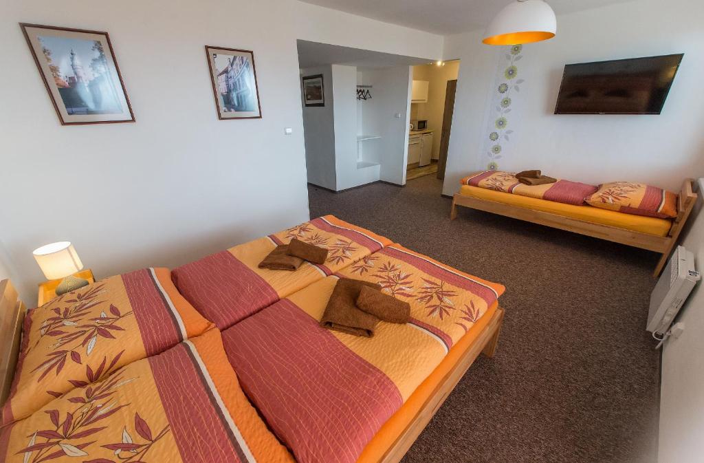 Postel nebo postele na pokoji v ubytování Penzion TOP