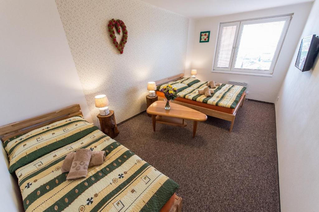 Postel nebo postele na pokoji v ubytování Penzion TOP