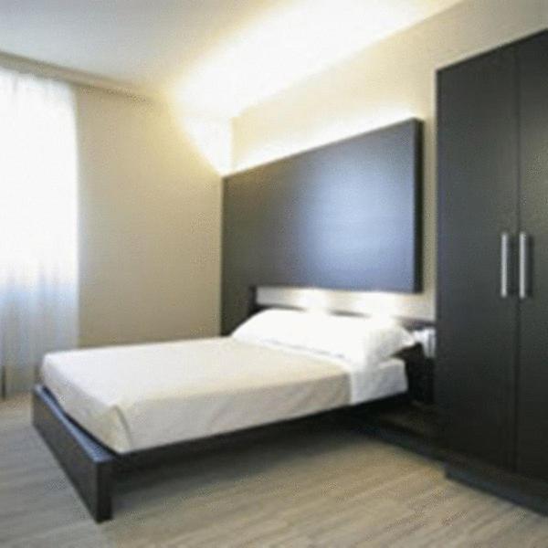 Postel nebo postele na pokoji v ubytování Art Hotel Udine