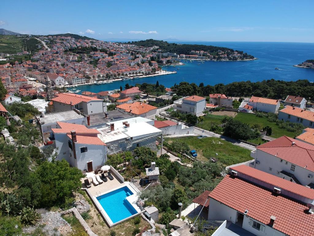 an aerial view of a house with a swimming pool at Fio's in Hvar