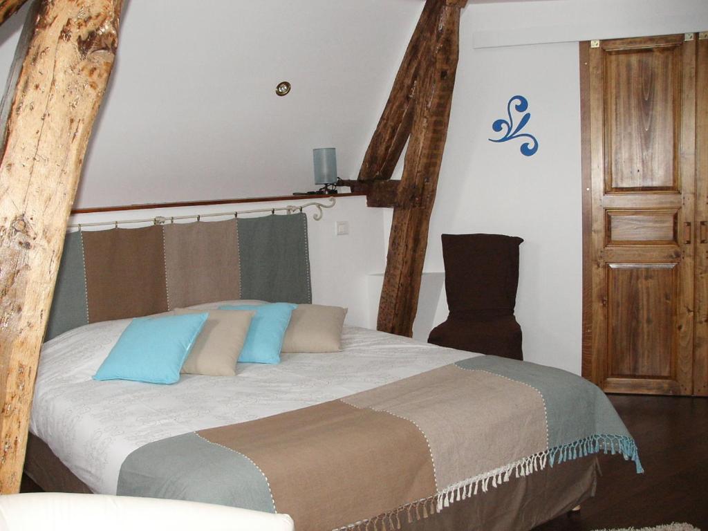 Postel nebo postele na pokoji v ubytování Logis- Hôtel & Restaurant Le Montligeon