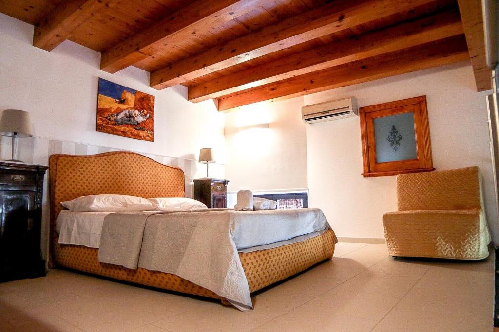 a bedroom with a bed in a room with wooden ceilings at Mega House in Catania