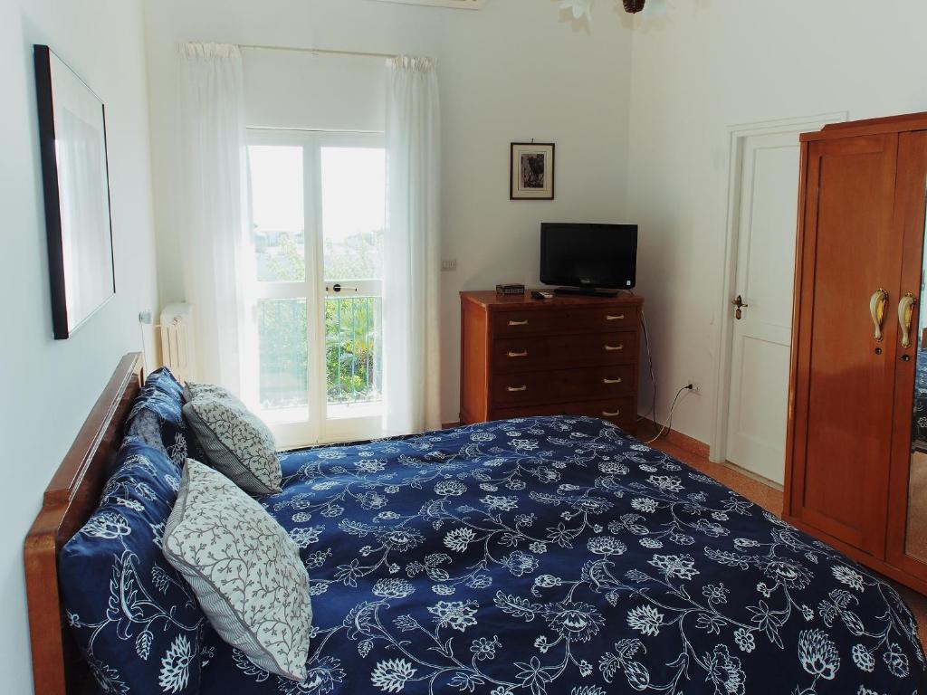 Postel nebo postele na pokoji v ubytování Il Gelso