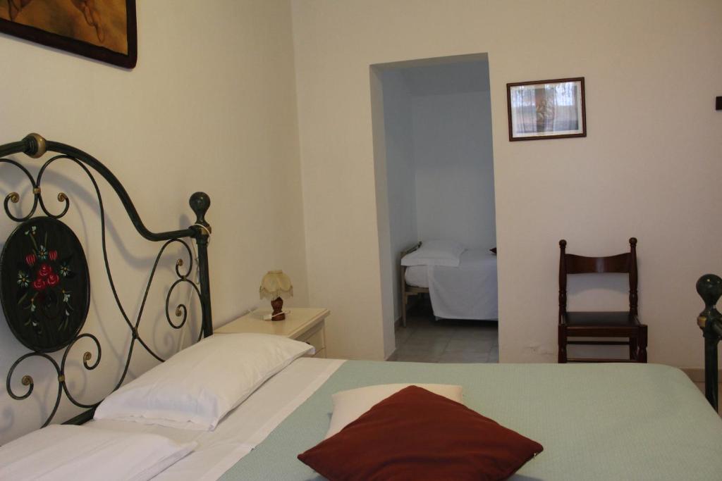 Postel nebo postele na pokoji v ubytování Agriturismo I Portici