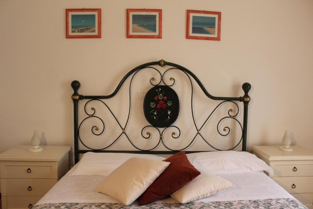 Postel nebo postele na pokoji v ubytování Agriturismo I Portici