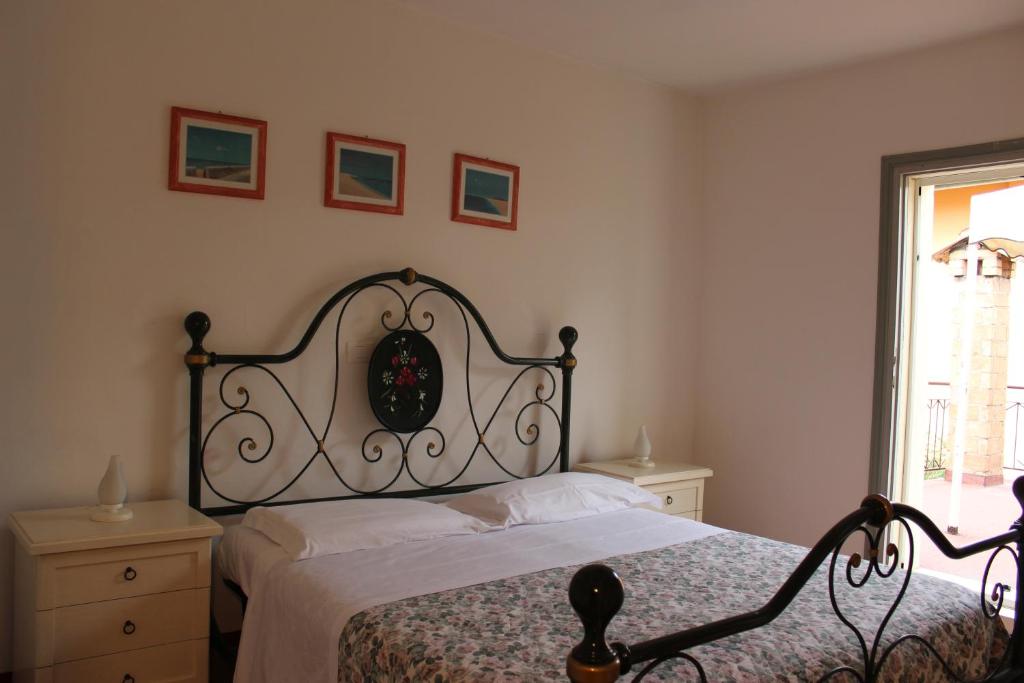 Postel nebo postele na pokoji v ubytování Agriturismo I Portici