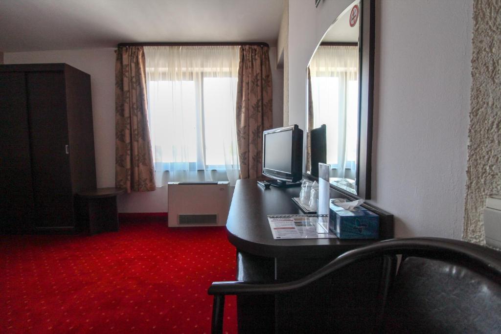TV a/nebo společenská místnost v ubytování Hotel Razvan