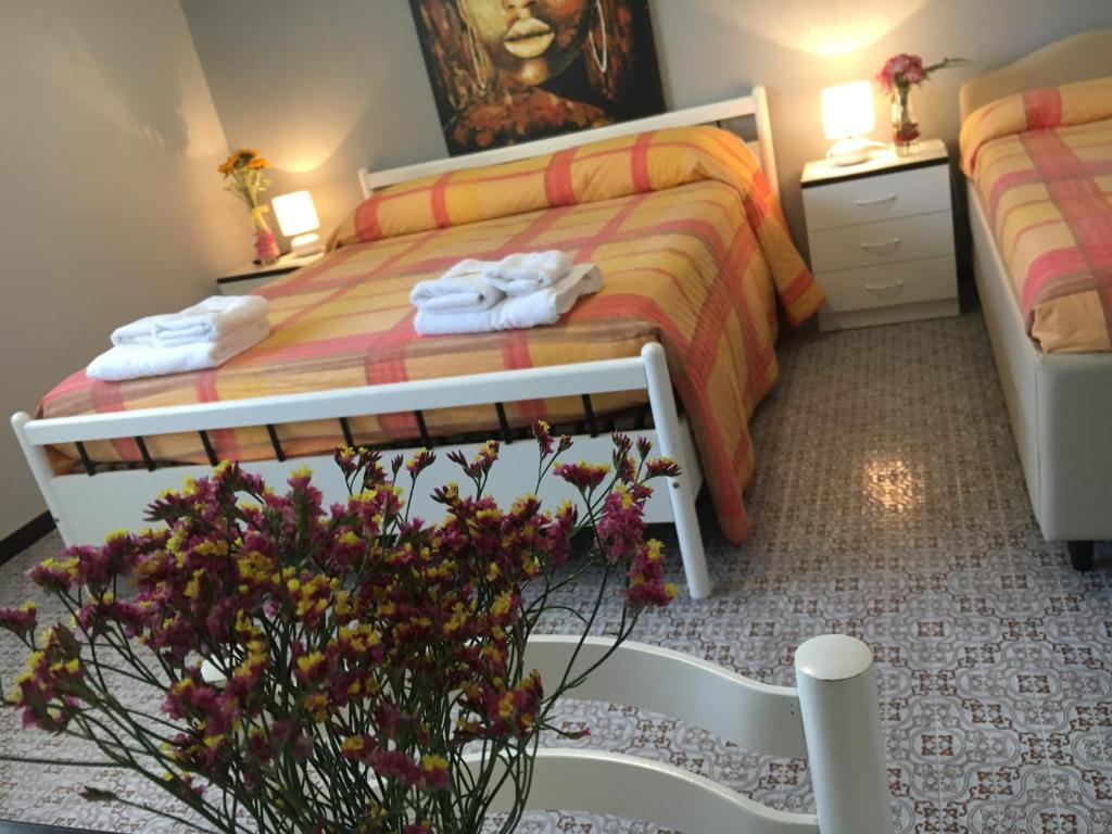 Postel nebo postele na pokoji v ubytování Hotel Gianna