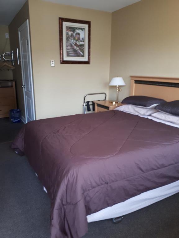 Postel nebo postele na pokoji v ubytování Park Motel