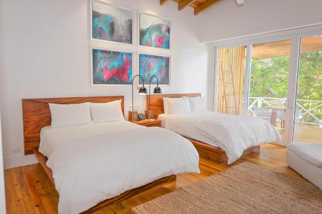 Postel nebo postele na pokoji v ubytování Ibagari Boutique Hotel