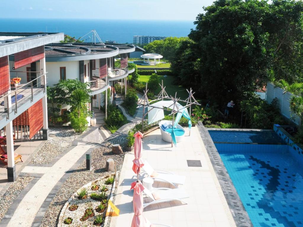 an aerial view of a house with a swimming pool at Luz_ita Sunshine Villa in Uluwatu