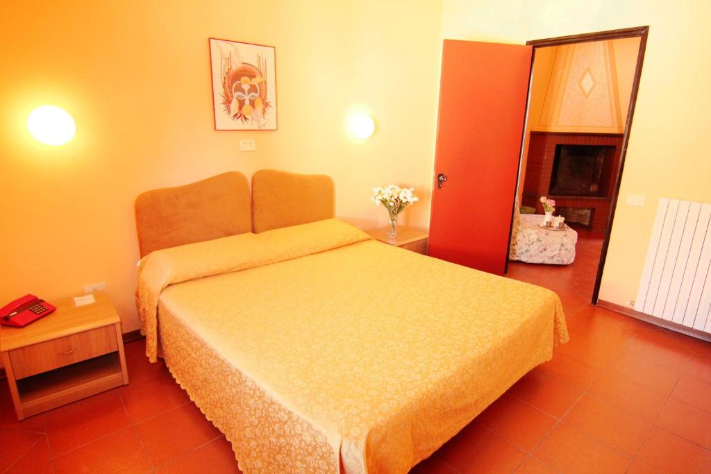Postel nebo postele na pokoji v ubytování Hotel Boni Cerri