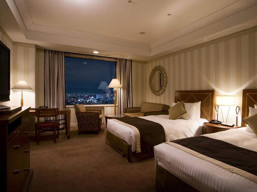 Postel nebo postele na pokoji v ubytování Imperial Hotel Osaka