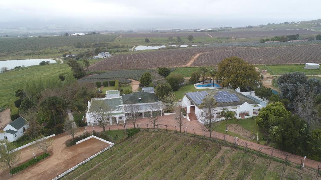an aerial view of a home with solar panels on the roof at Zonnevanger Guesthouse in Noorder-Paarl