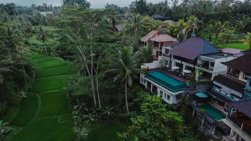an aerial view of a house in the forest at River Sakti Ubud by Prasi in Ubud