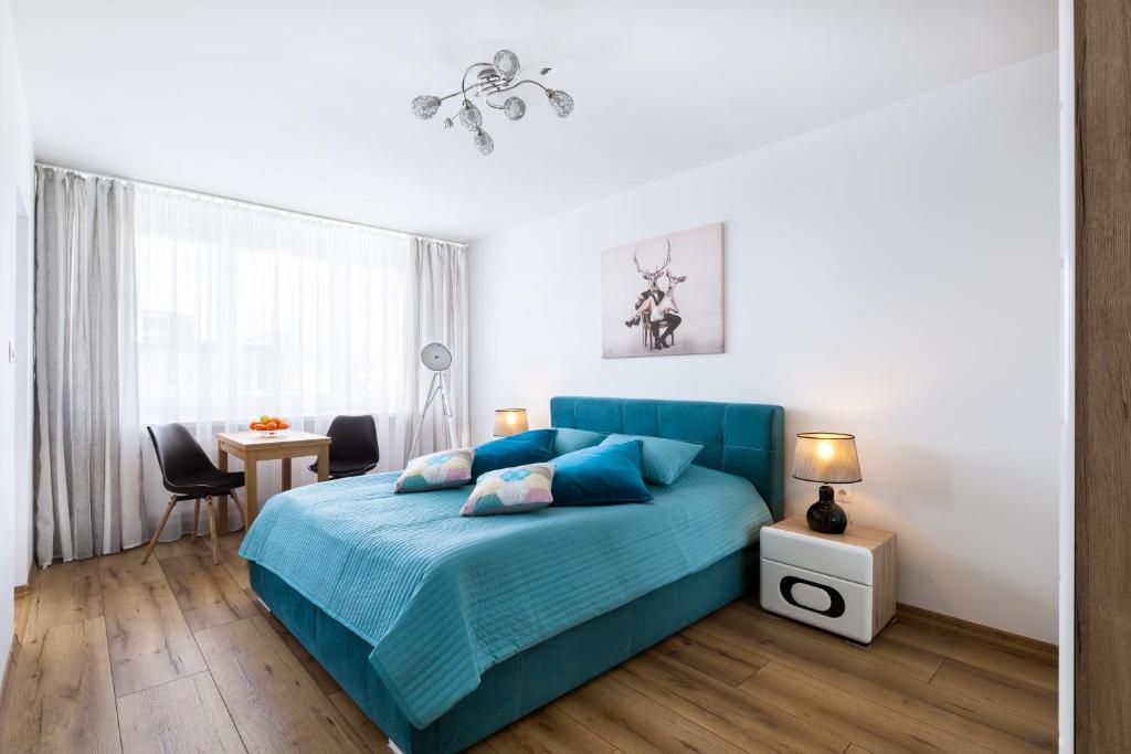 En eller flere senge i et værelse på Apartament Stag Karkonosz - 2 osobne pokoje - by Space Apart