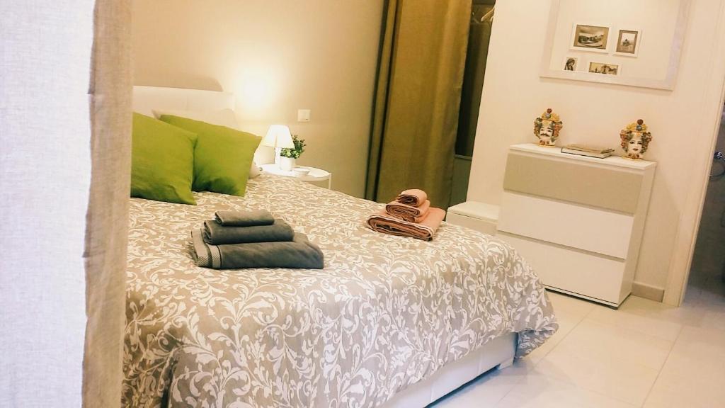 Posteľ alebo postele v izbe v ubytovaní Casa Cleone