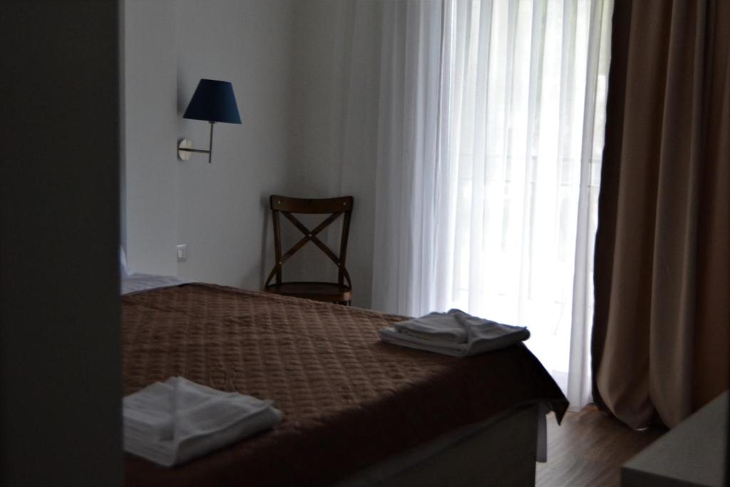 Postel nebo postele na pokoji v ubytování Hotel La Terrazza