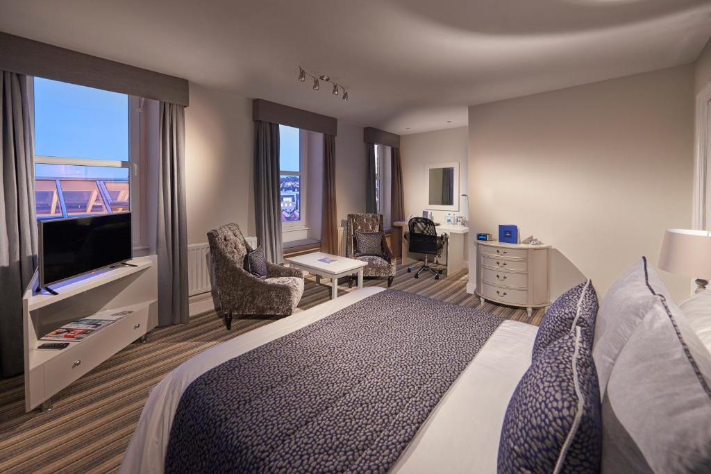 Postel nebo postele na pokoji v ubytování La Fregate Hotel