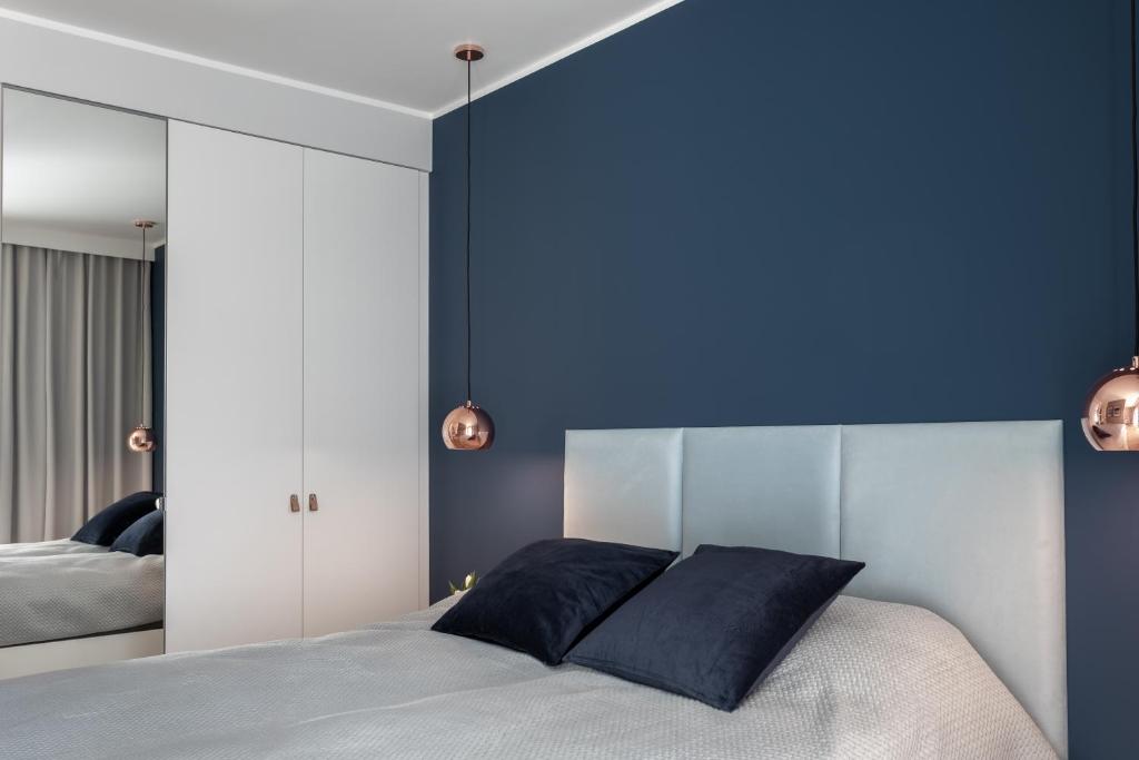 Posteľ alebo postele v izbe v ubytovaní Apartament CLIF