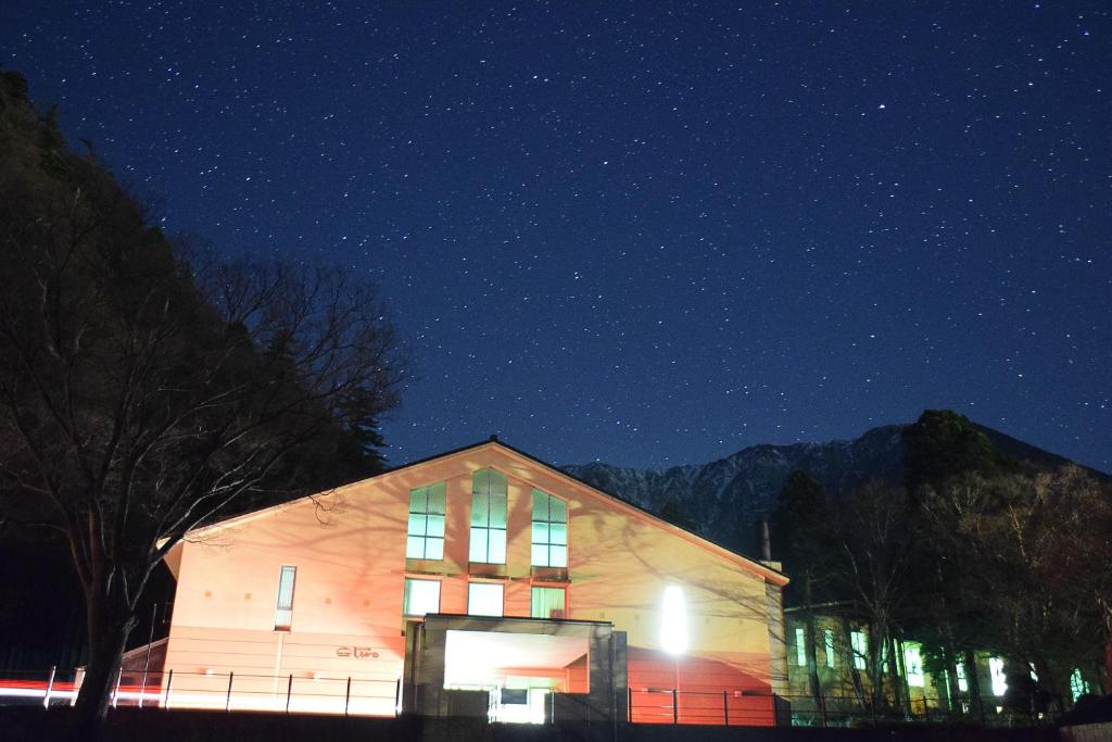 a building at night with a starry sky at Hotel Daisen Shirogane in Daisen