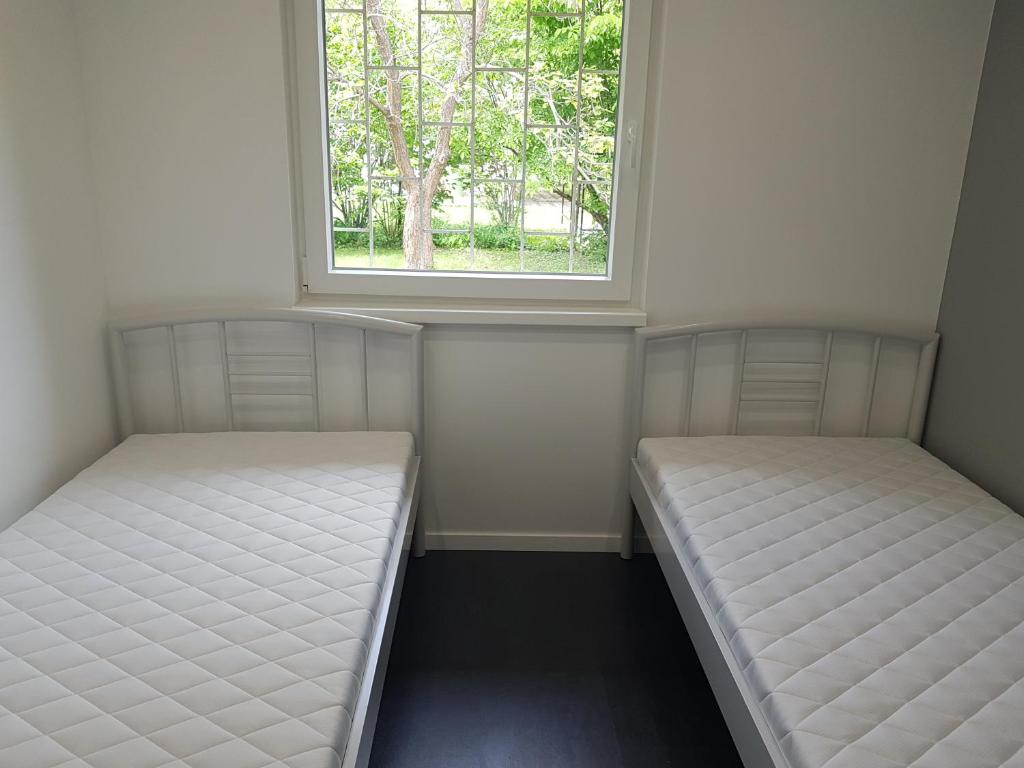 Posteľ alebo postele v izbe v ubytovaní Picurka Apartman