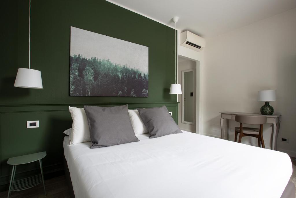 Postel nebo postele na pokoji v ubytování Hotel Orso Bruno