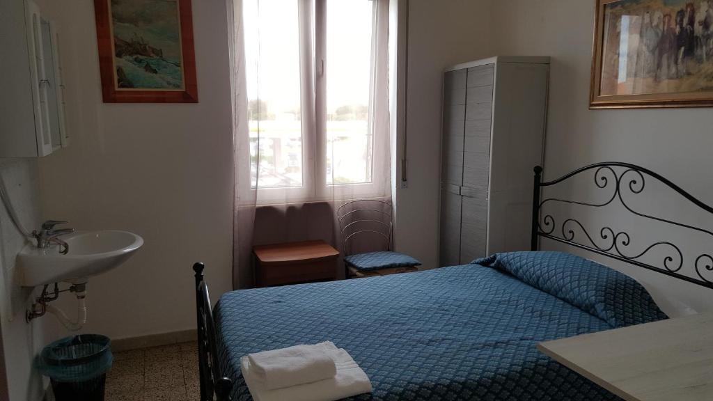 Postel nebo postele na pokoji v ubytování Albergo Pensione Ardenza SELF CHECK-IN