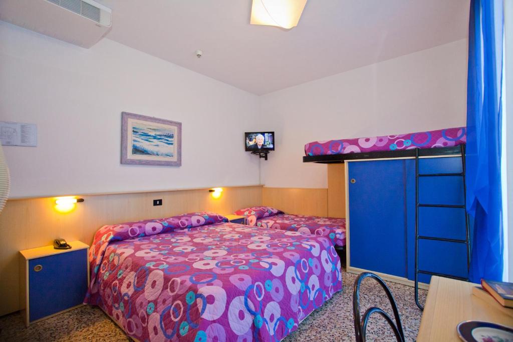 Postel nebo postele na pokoji v ubytování Hotel Catto Suisse