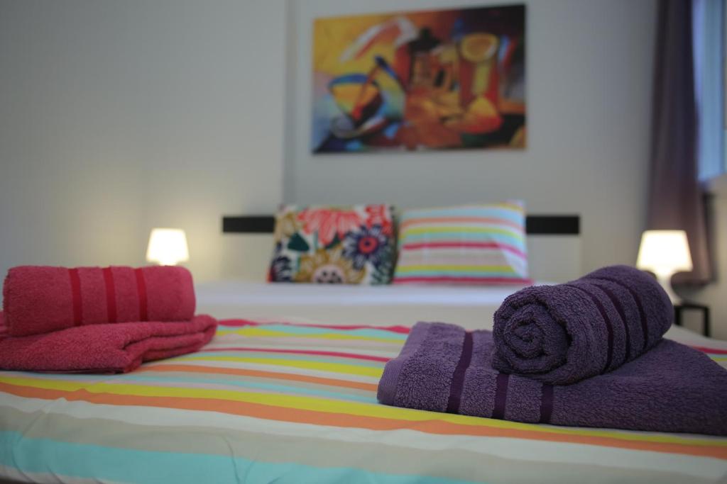 Postel nebo postele na pokoji v ubytování Central Studio Flat