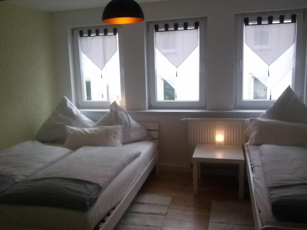 Una cama o camas en una habitación de Ferienwohnung Konrad - nahe Chemnitz