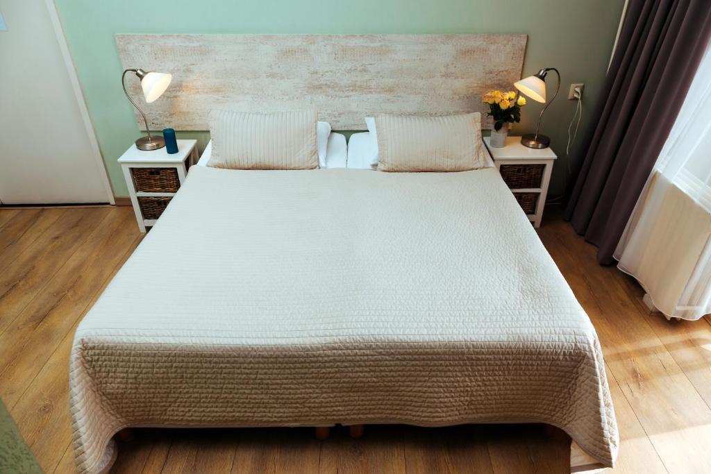 Postel nebo postele na pokoji v ubytování Hotel Corel