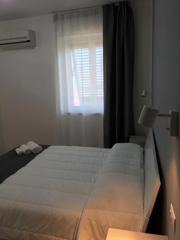 Posteľ alebo postele v izbe v ubytovaní Andrea Case Vacanze L'Ancora